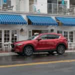 red mazda cx5 parked on side of road