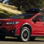 Red 2023 Subaru Crosstrek Premium Driving on Road