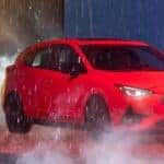 Red 2024 Subaru Impreza RS on Stage in Rain