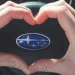 Heart Hands over Subaru Steering Wheel