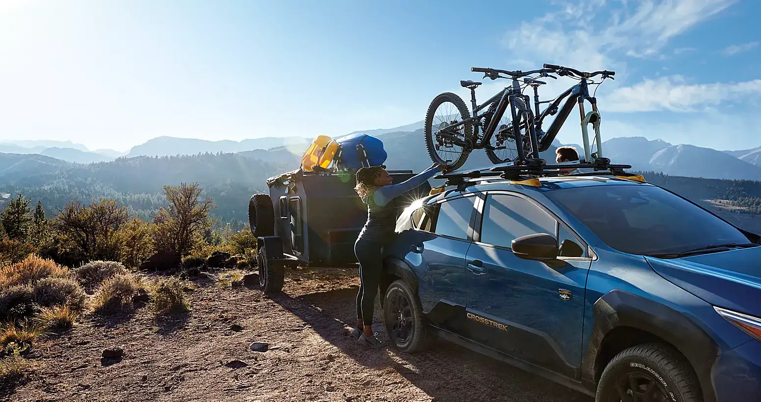 2026 Subaru Crosstrek with a bicycle at a scenic overlook