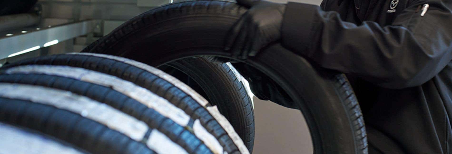 Tire picture of technician checking tire pressure