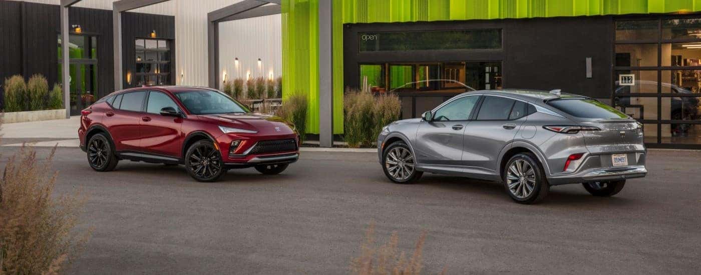 A red and a silver 2024 Buick Envista ST facing each other