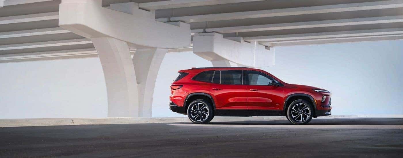 A red 2026 Buick Enclave after leaving a Buick dealer near Apopka.