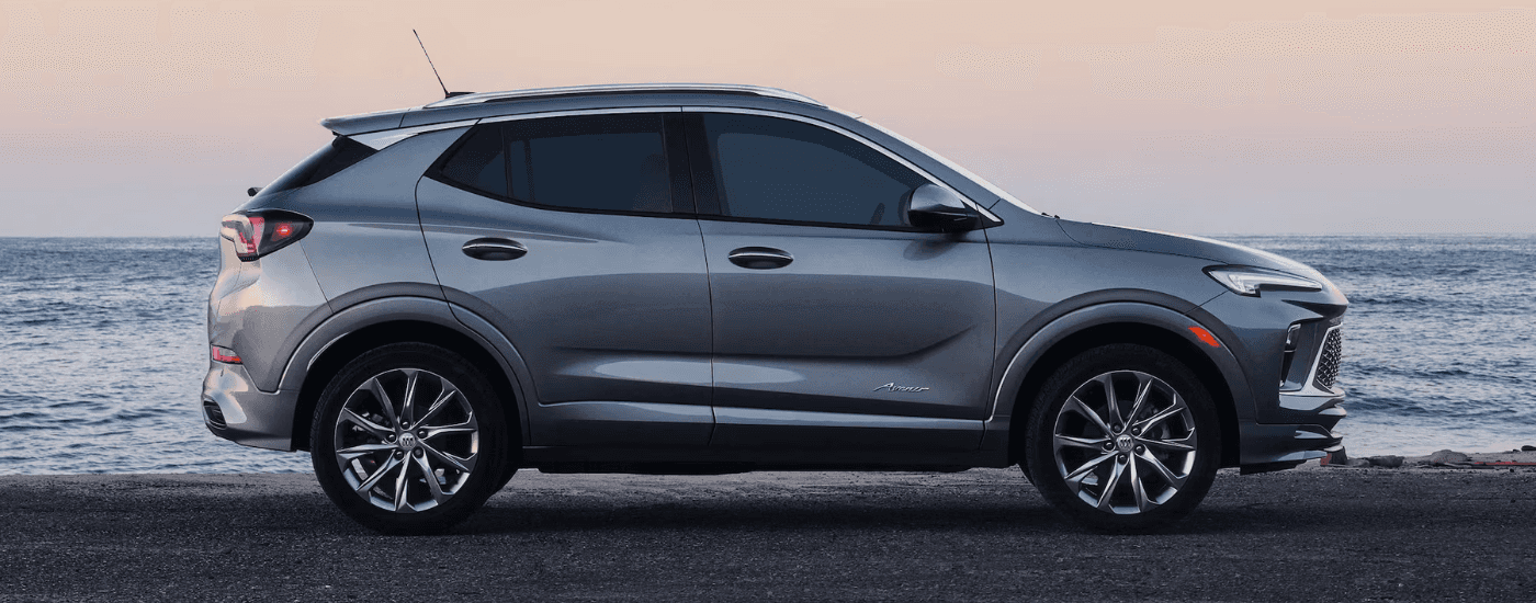 Side profile of a silver 2026 Buick Encore GX Avenir