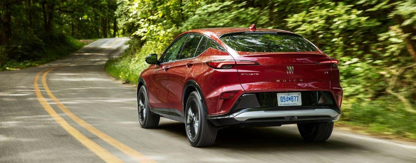 Red 2024 Buick Envista ST driving to a Buick dealer near The Villages