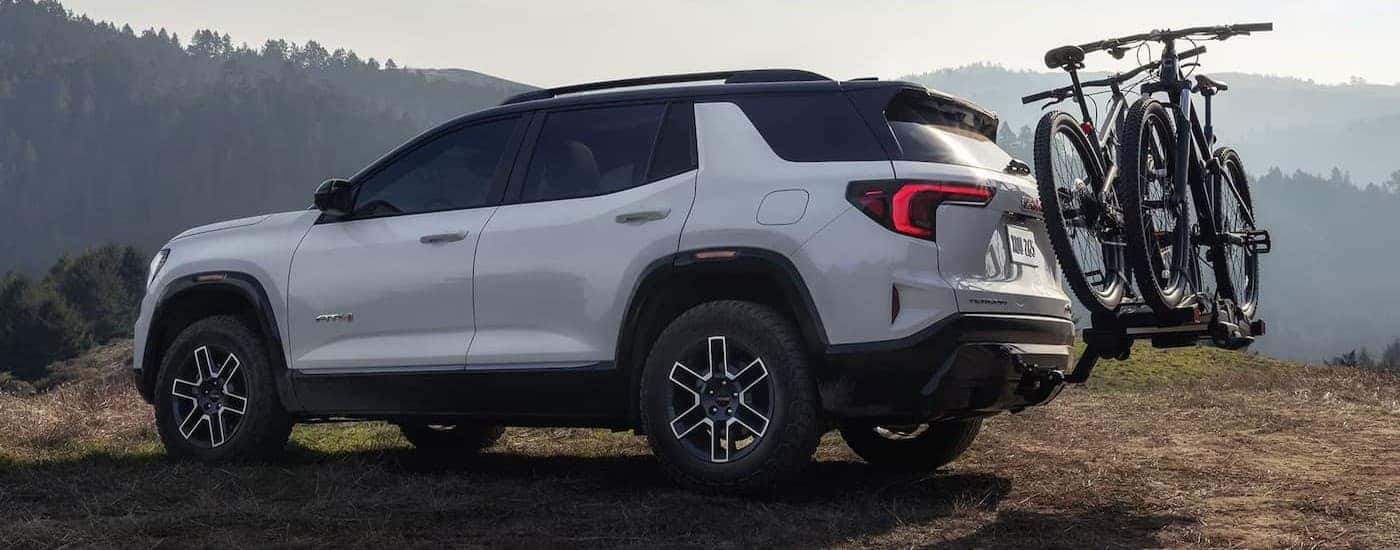 A white 2026 GMC Terrain AT4 parked off-road.