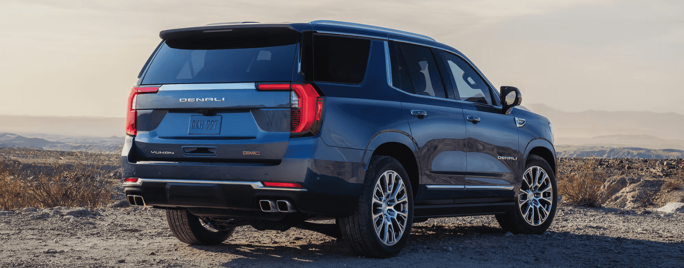 Black 2026 GMC Yukon Denali parked from the rear