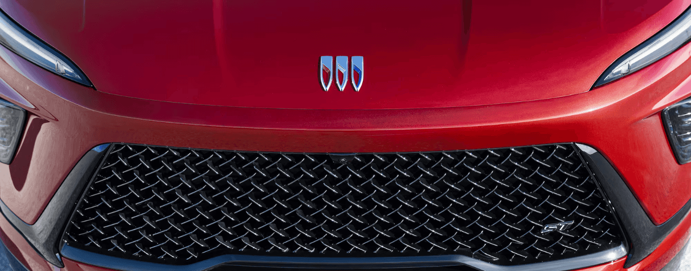 Front Buick badging on a red 2026 Buick Enclave