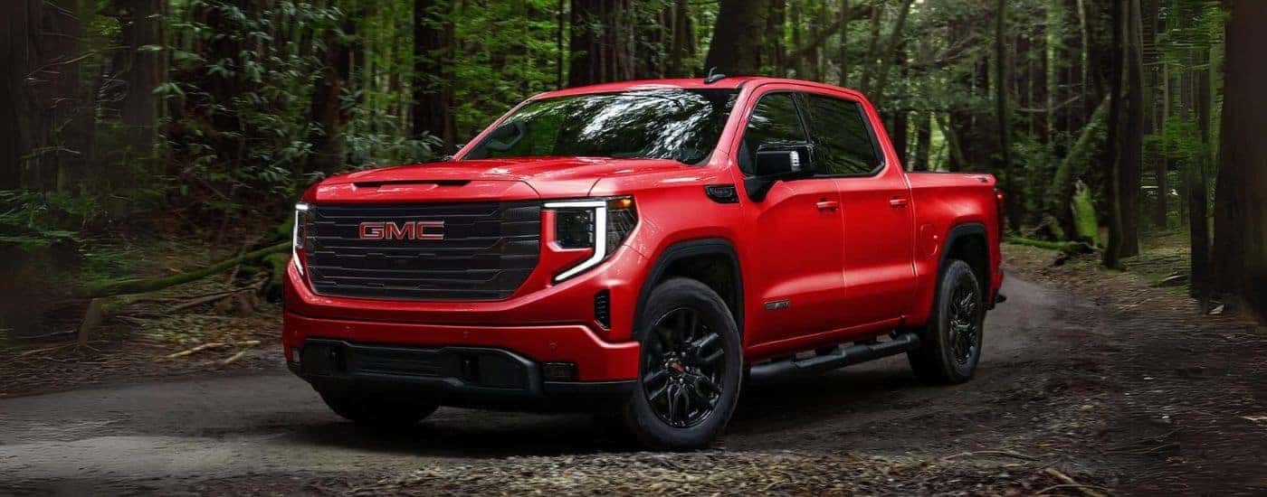 Red 2024 GMC Sierra 1500 Elevation parked off-road