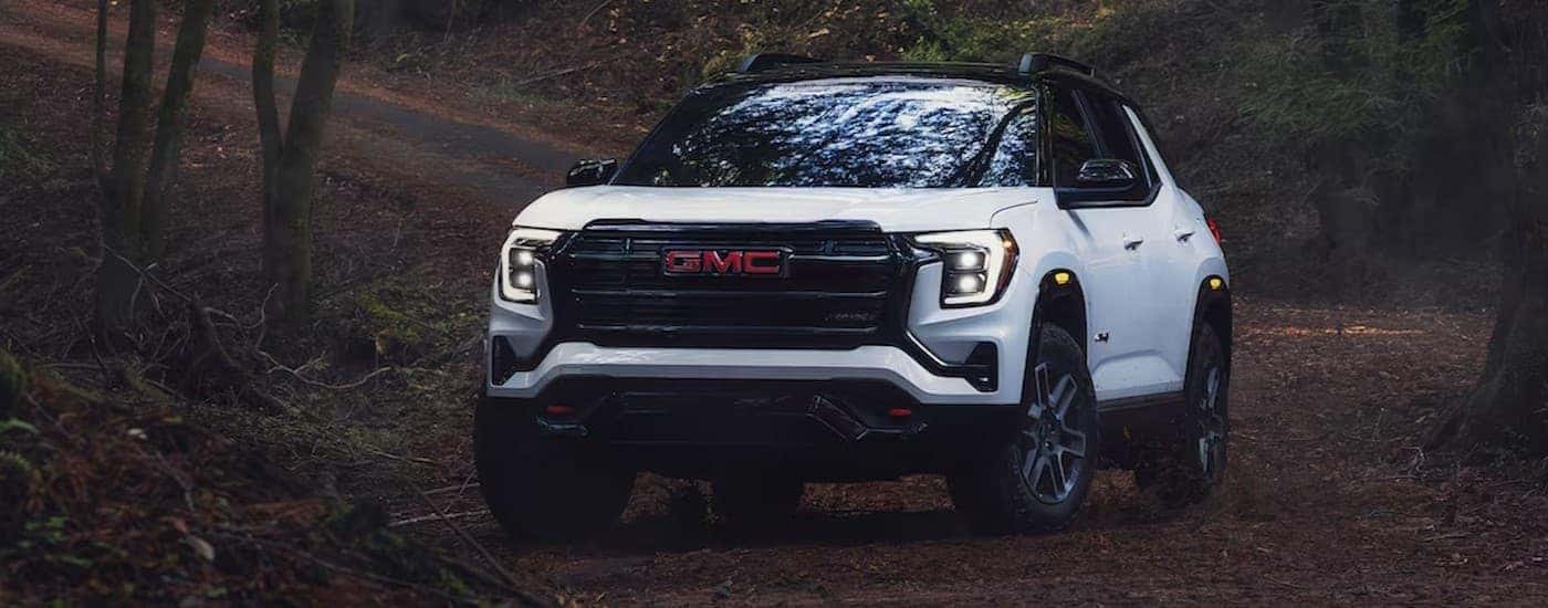A white 2026 GMC Terrain parked offroad.
