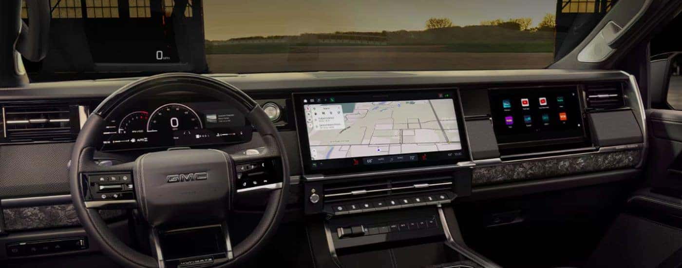 The front interior and infotainment showing navigation on a GMC 2027 GMC Sierra 1500.