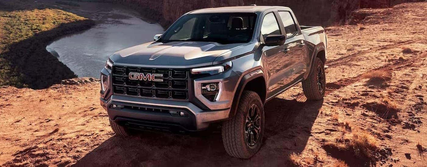 A silver 2024 GMC Canyon parked offroad.