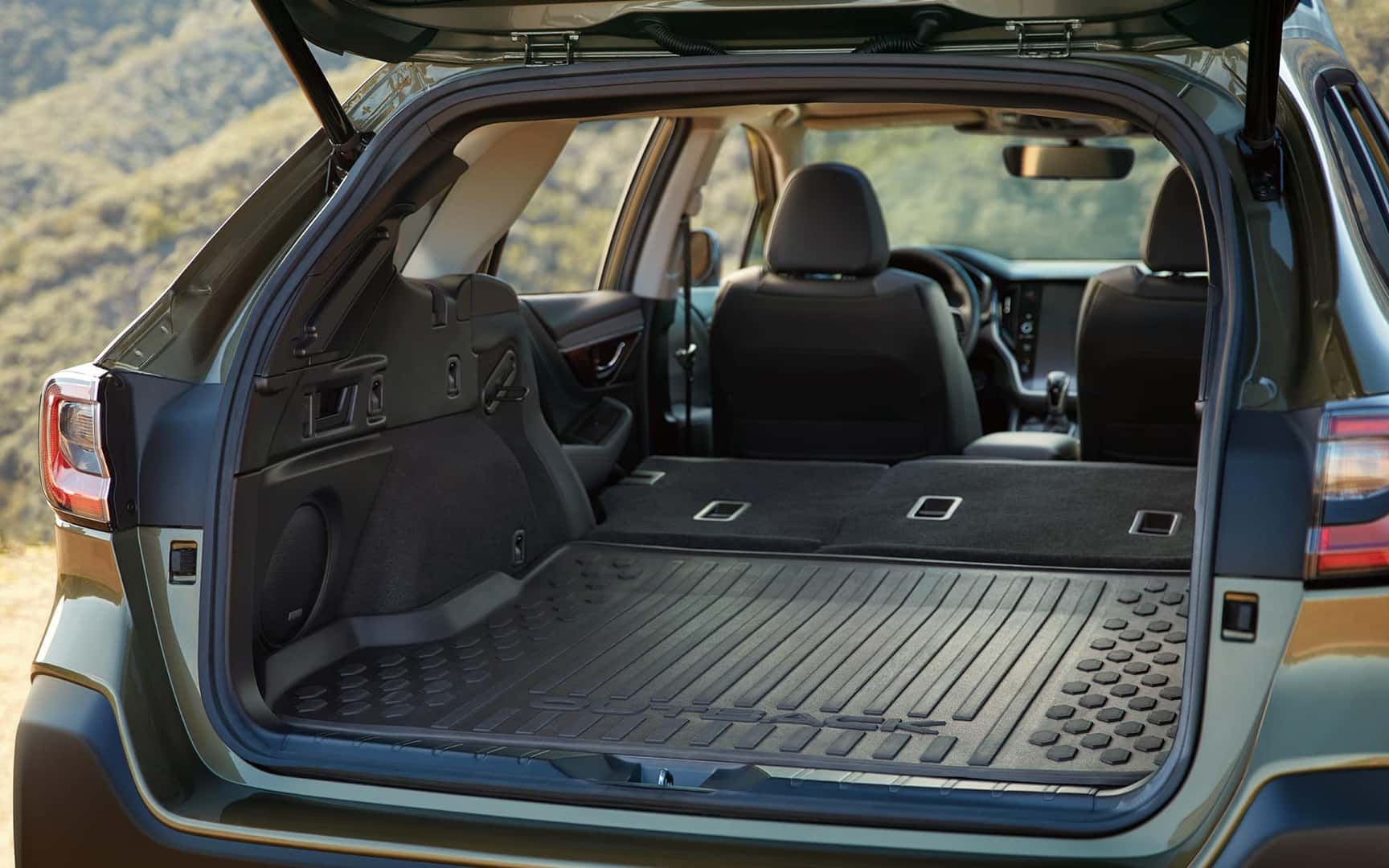 Interior Rear shot of empty Cargo Space in Outback Onyx Edition XT in Autumn Green Metallic with Gray StarTex Urethane_