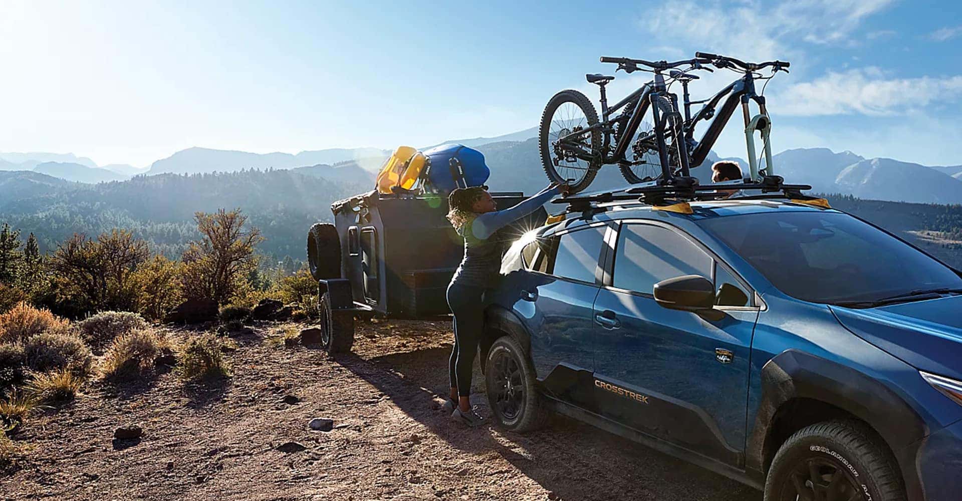 Lady camping with 2025 Subaru Crosstrek Wilderness