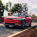 Red 2026 Subaru Solterra on road