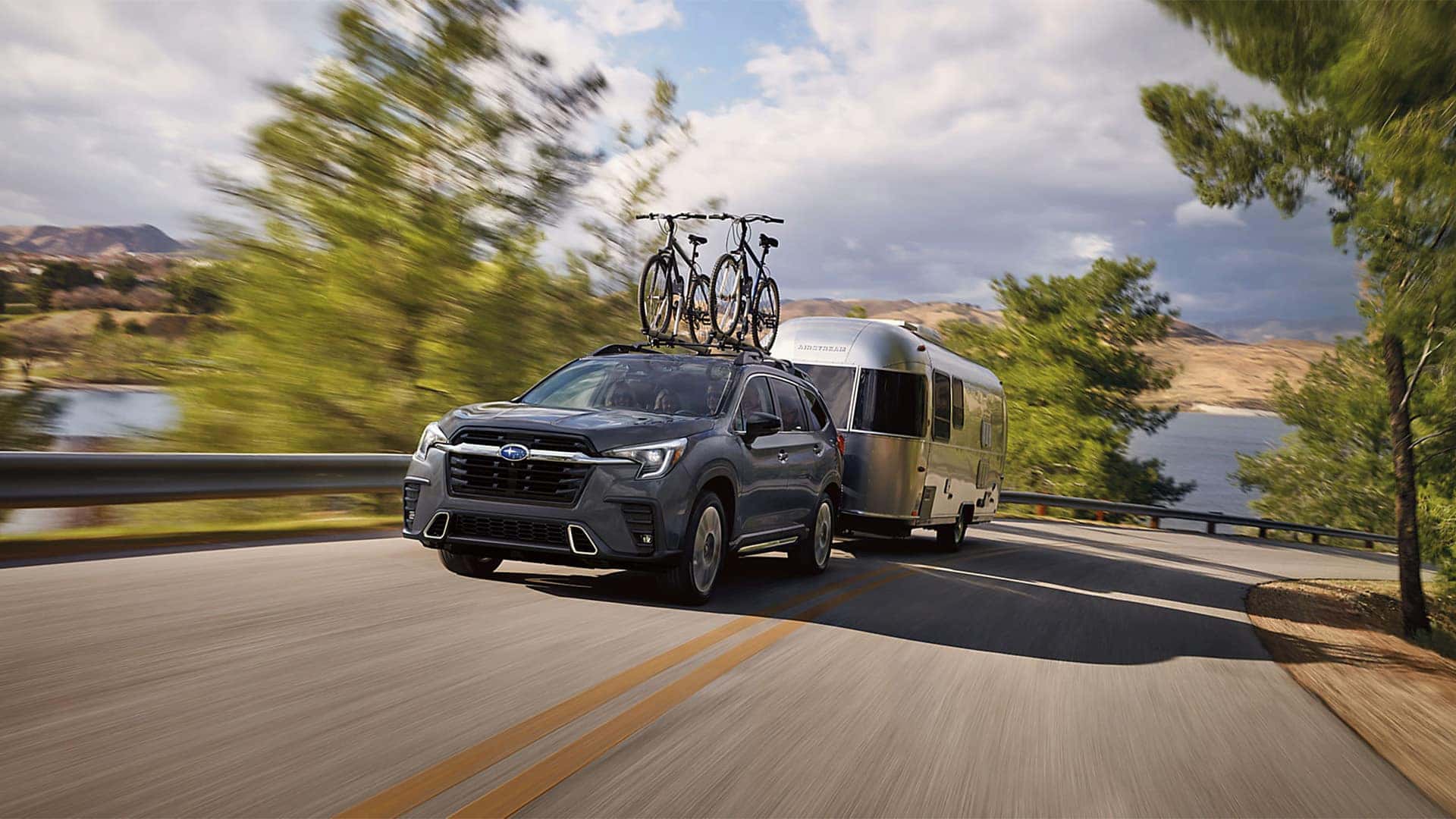 2026 Subaru Ascent with Bikes and trailer driving on the road