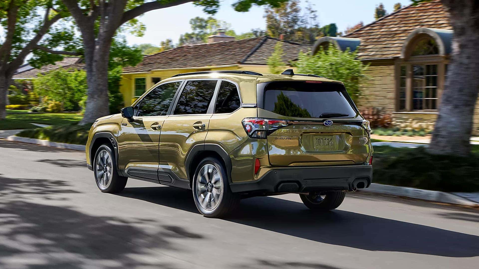 2026 Subaru Forester Hybrid driving down residential street