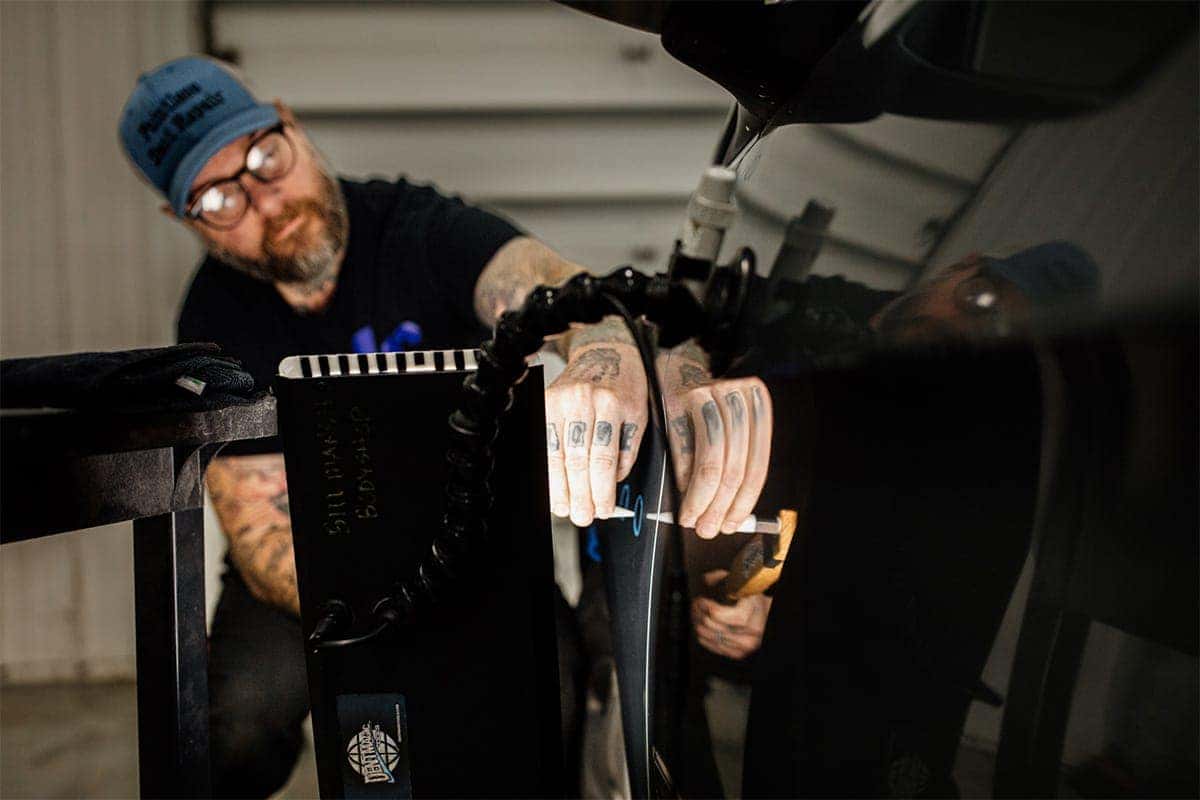 checking body panel for dents