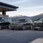 Luxury GMC vehicles in scenic setting