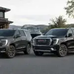 SUVs by the lakeside driveway