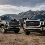 Heavy-Duty GMC Trucks Against Mountainous Terrain