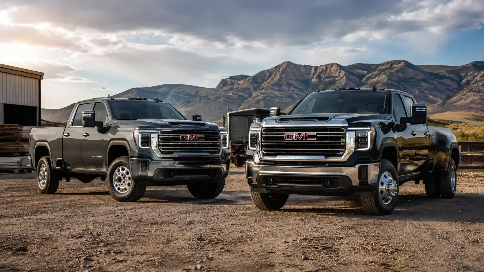 Heavy-Duty GMC Trucks Against Mountainous Terrain