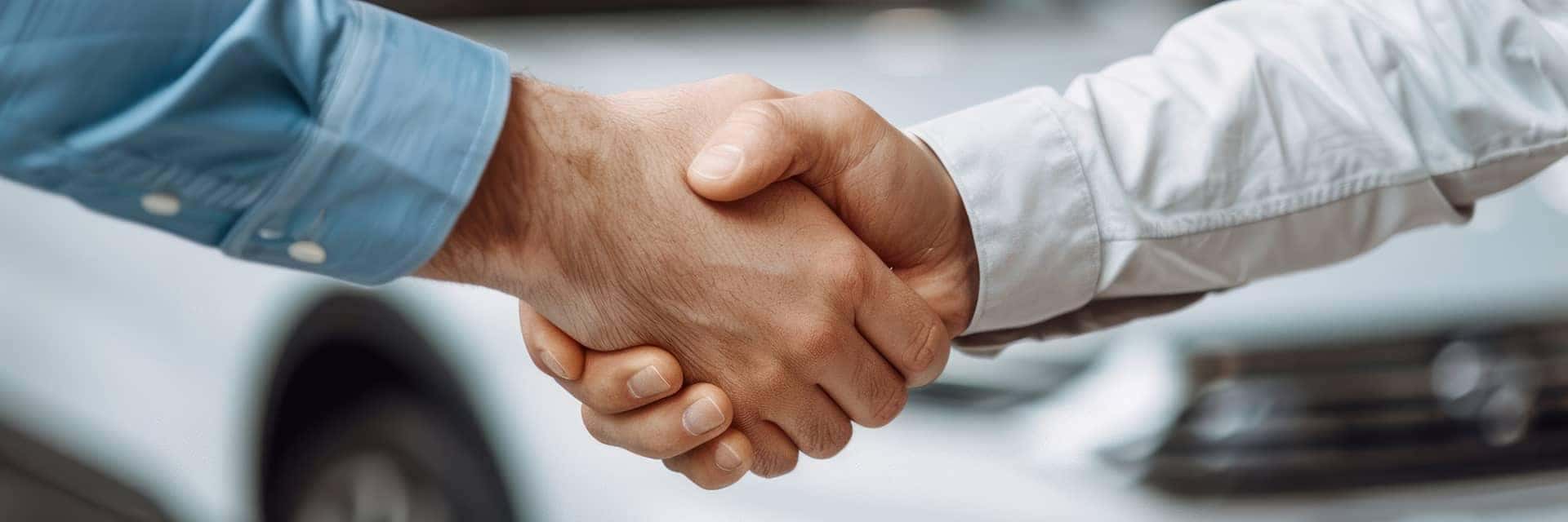 shaking hands at dealership