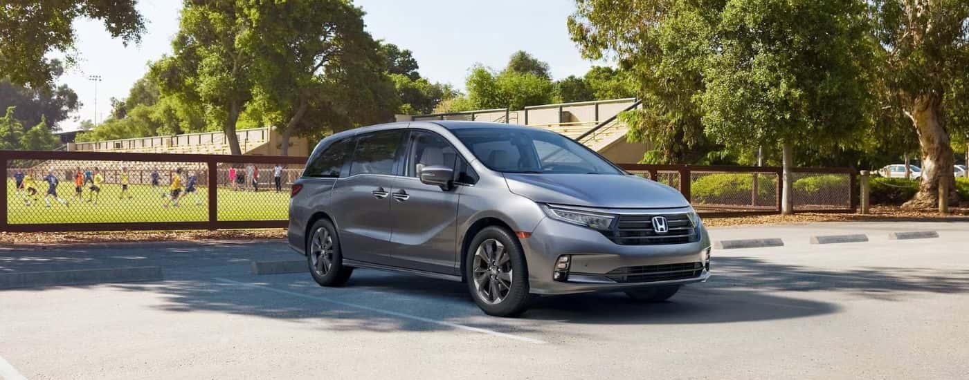 Gray 2024 Honda Odyssey parked near a field