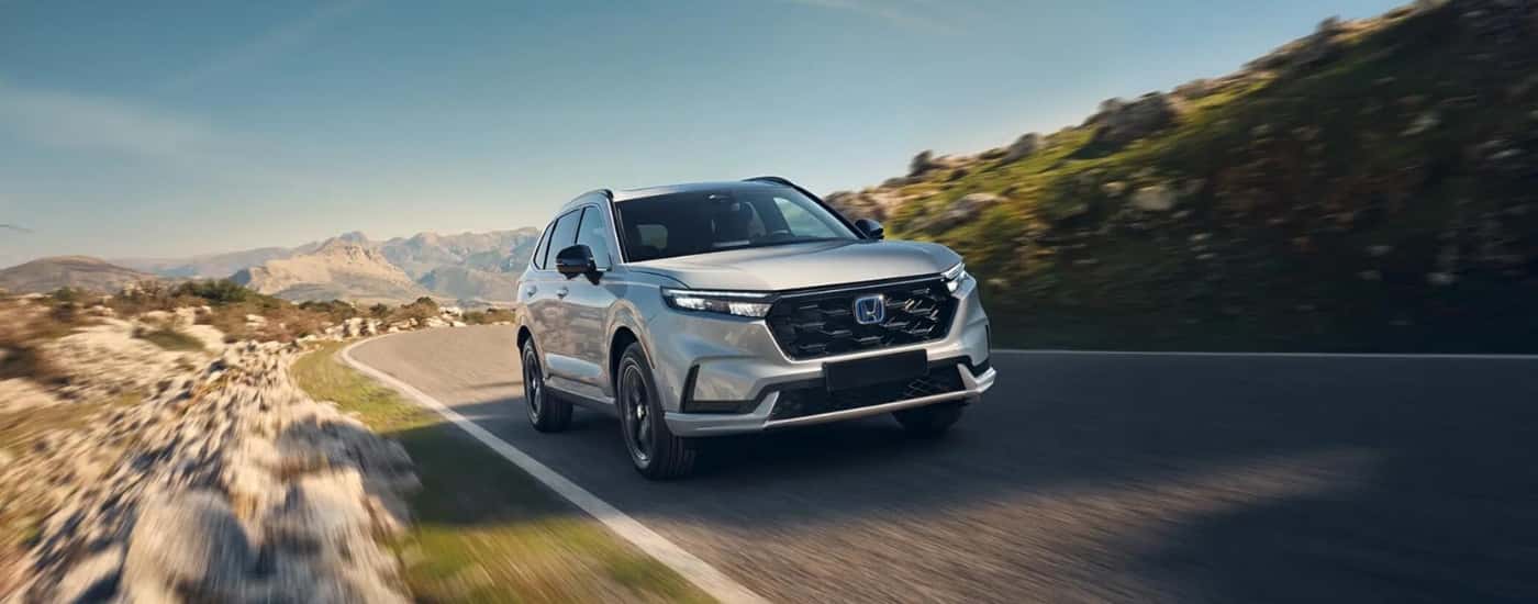 White 2026 Honda CR-V rounding a bend