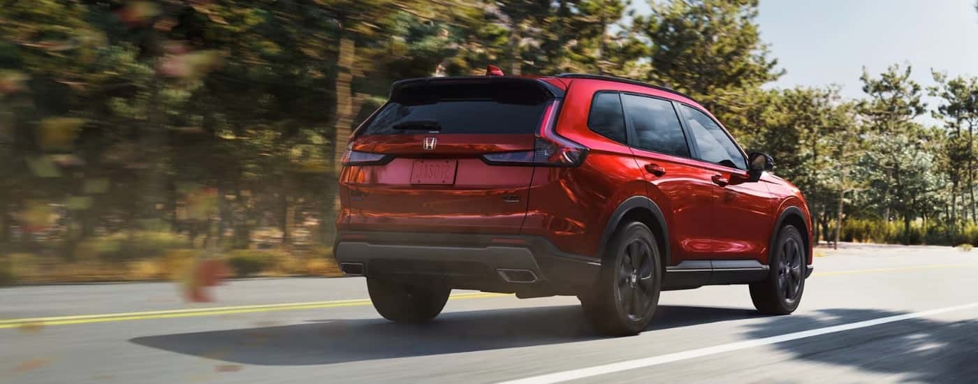 red 2026 Honda CR-V driving on a highway