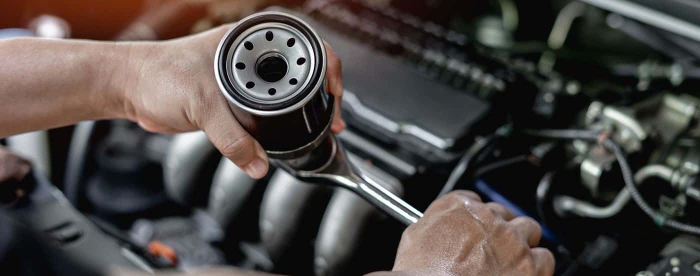 Technician installing an oil filter