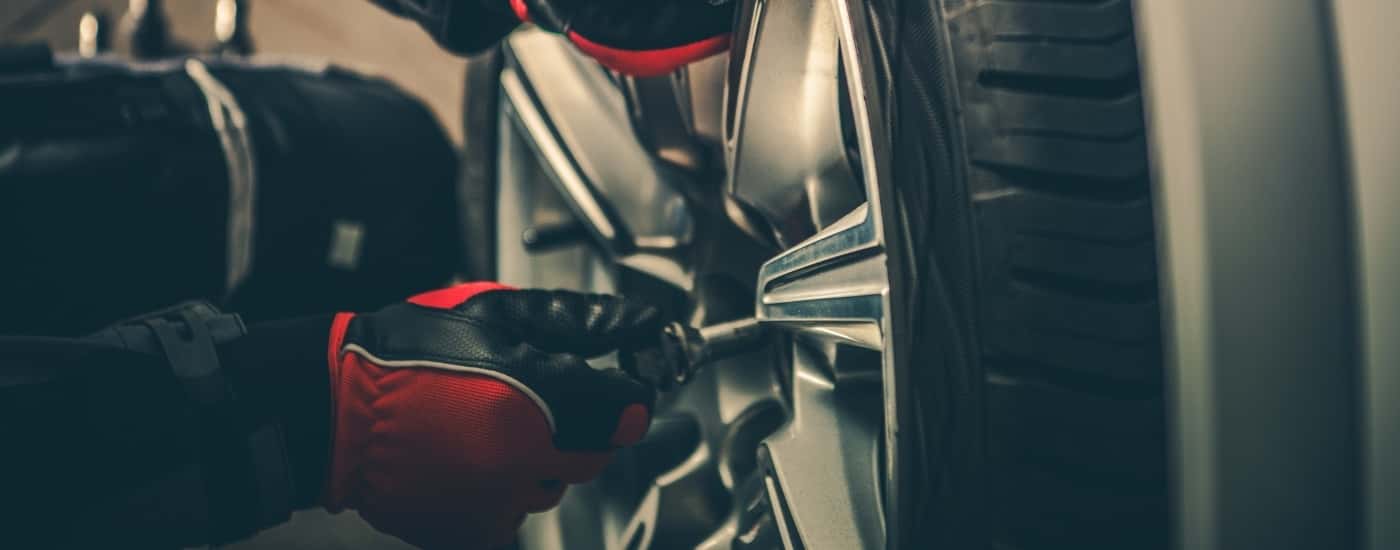 Technician installing a wheel