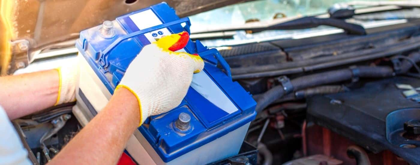 Technician installing a battery