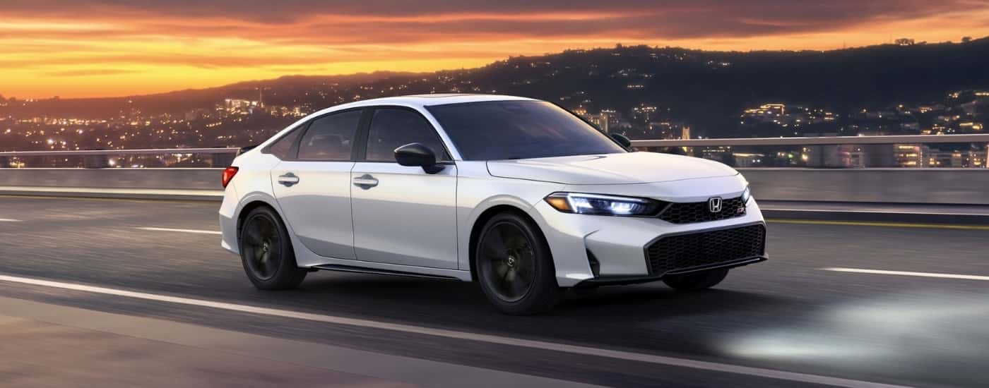 White 2026 Honda Civic Si for sale driving on a highway