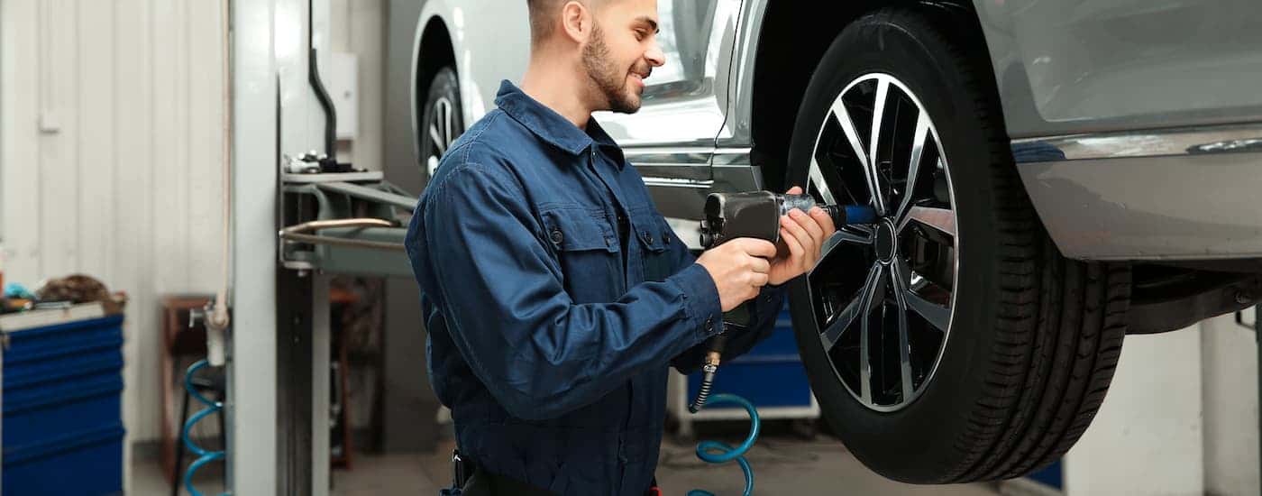 Technician installing a tire