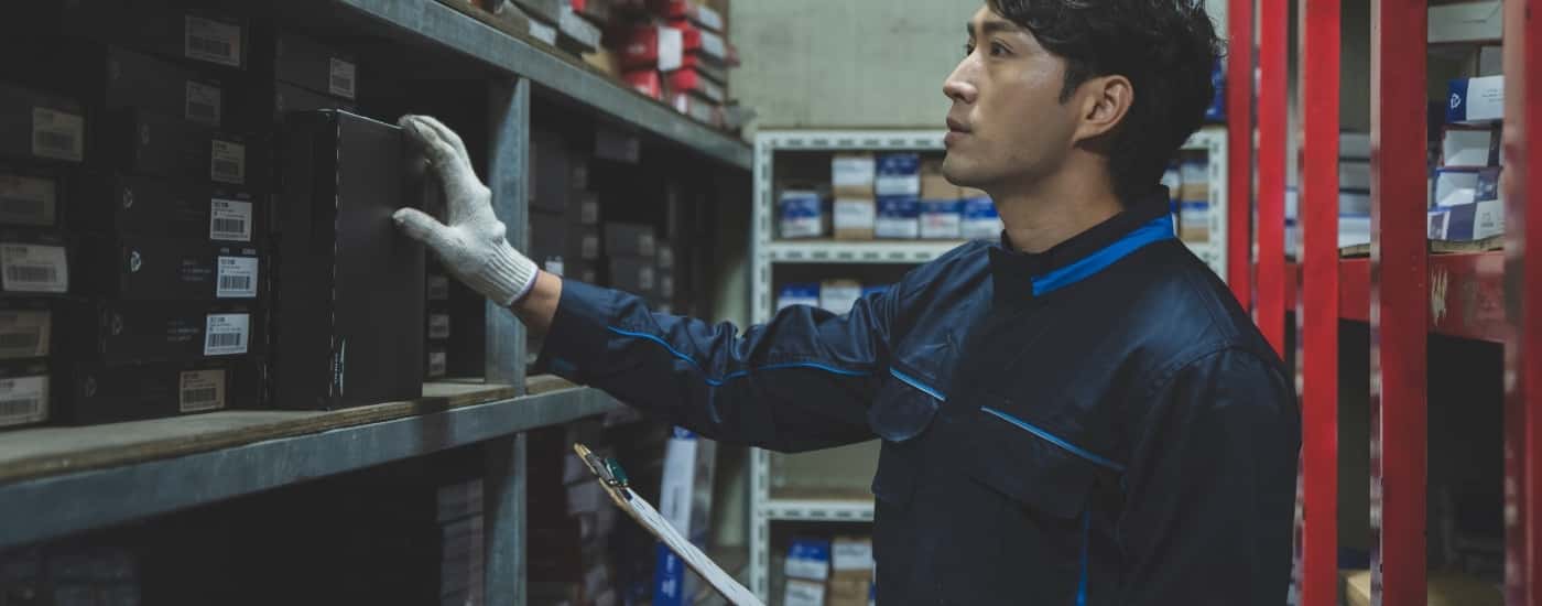 Technician look at parts
