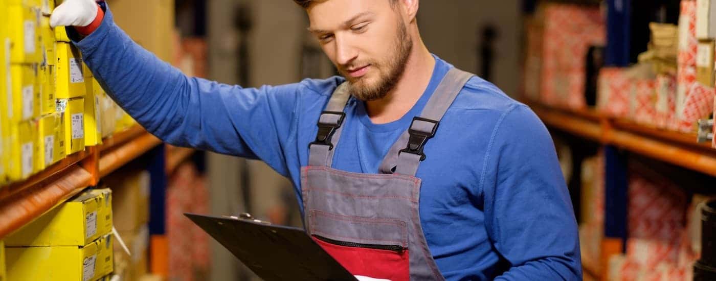 Technician grabbing car parts