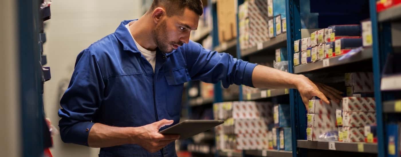 Technician grabbing car parts