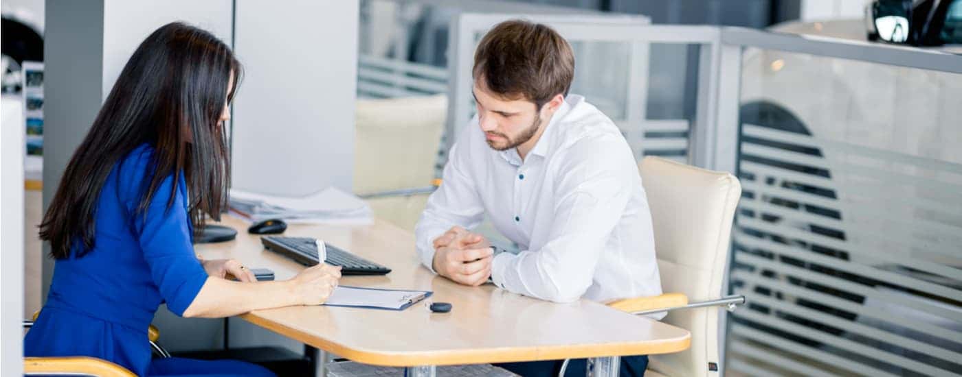 Person signing paperwork