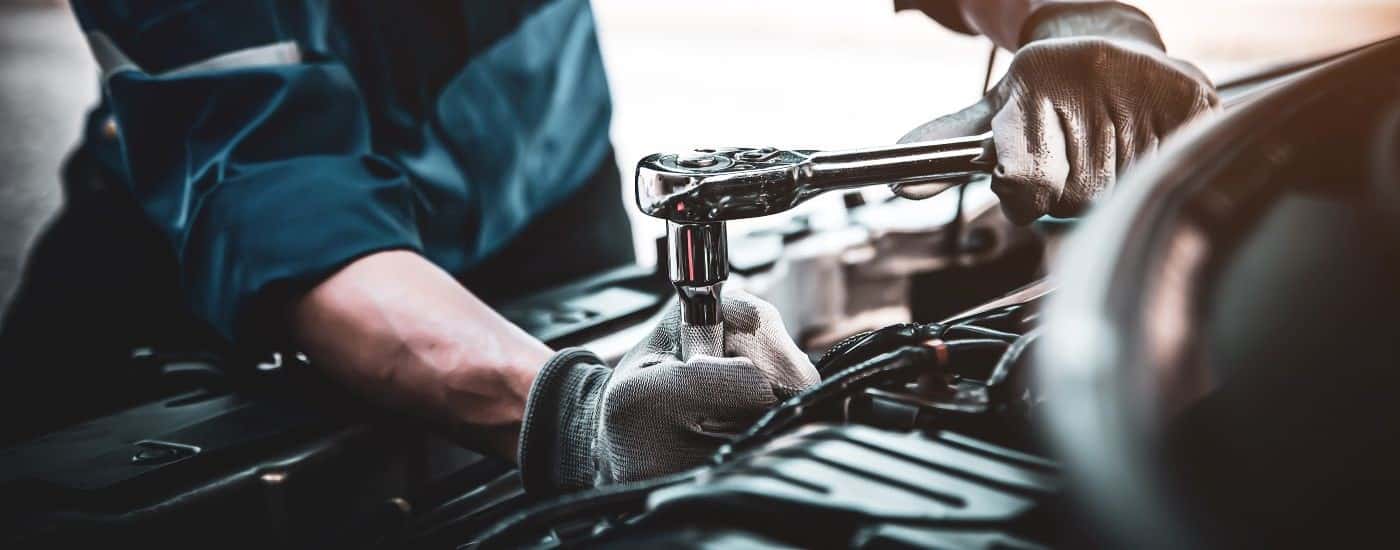 Technician servicing a vehicle