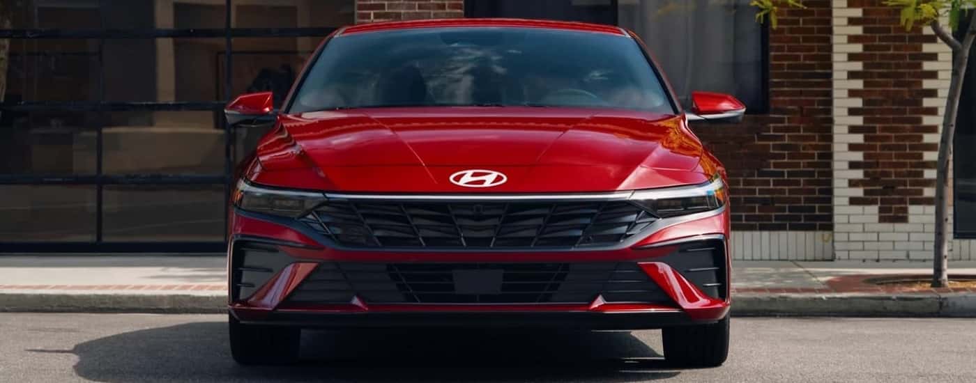 Red 2026 Hyundai Elantra Limited near a brick building