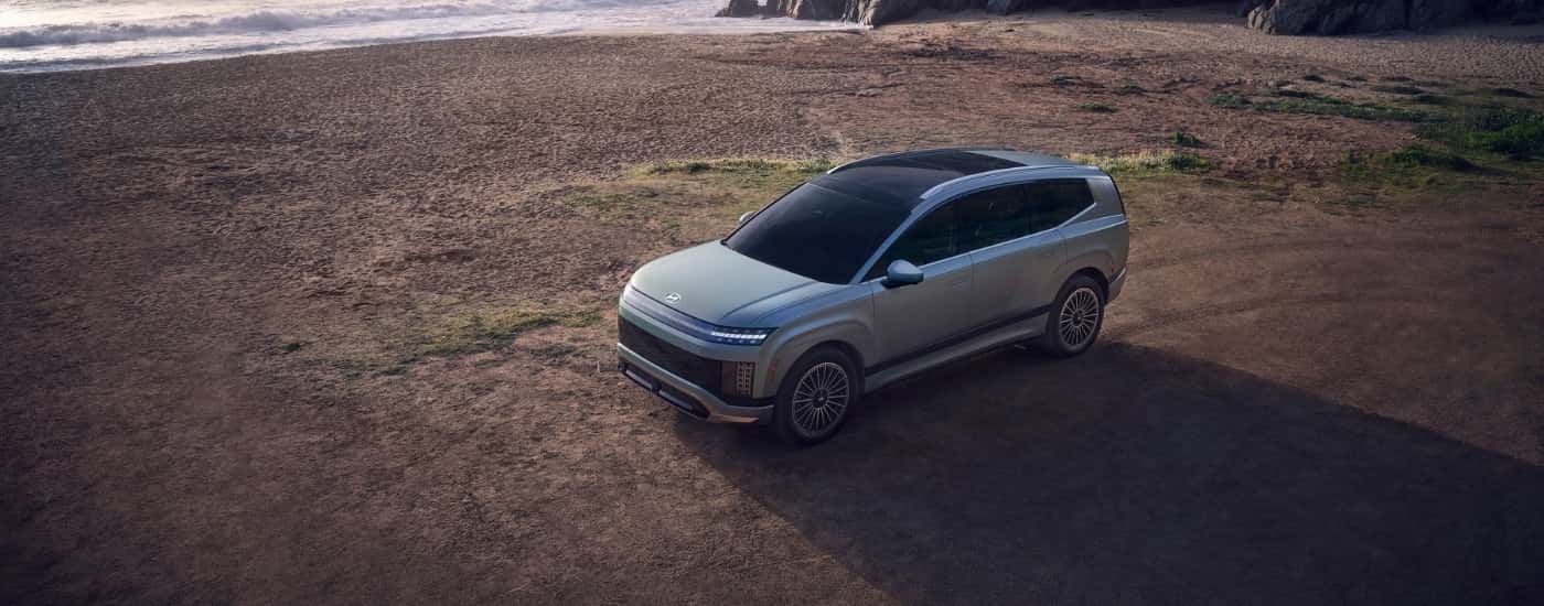 Grey 2026 Hyundai IONIQ 9 Calligraphy Design parked on a shore