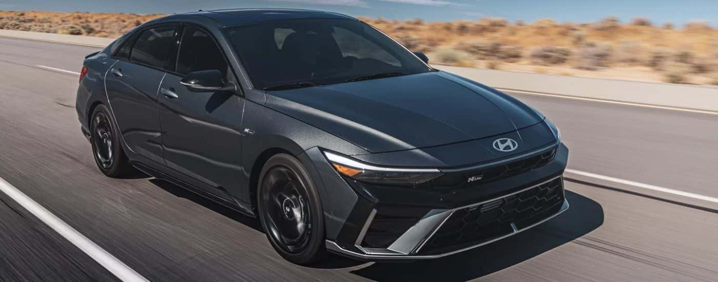 A gray 2026 Hyundai Elantra N Line driving a paved road.