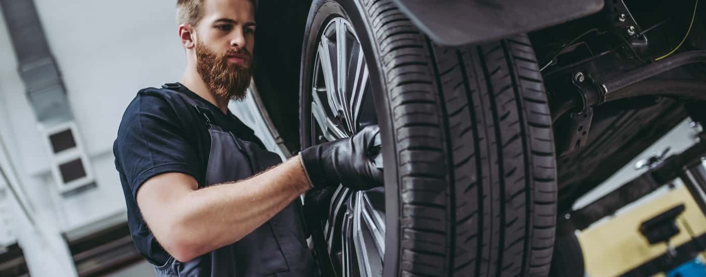 Technician installing a wheel