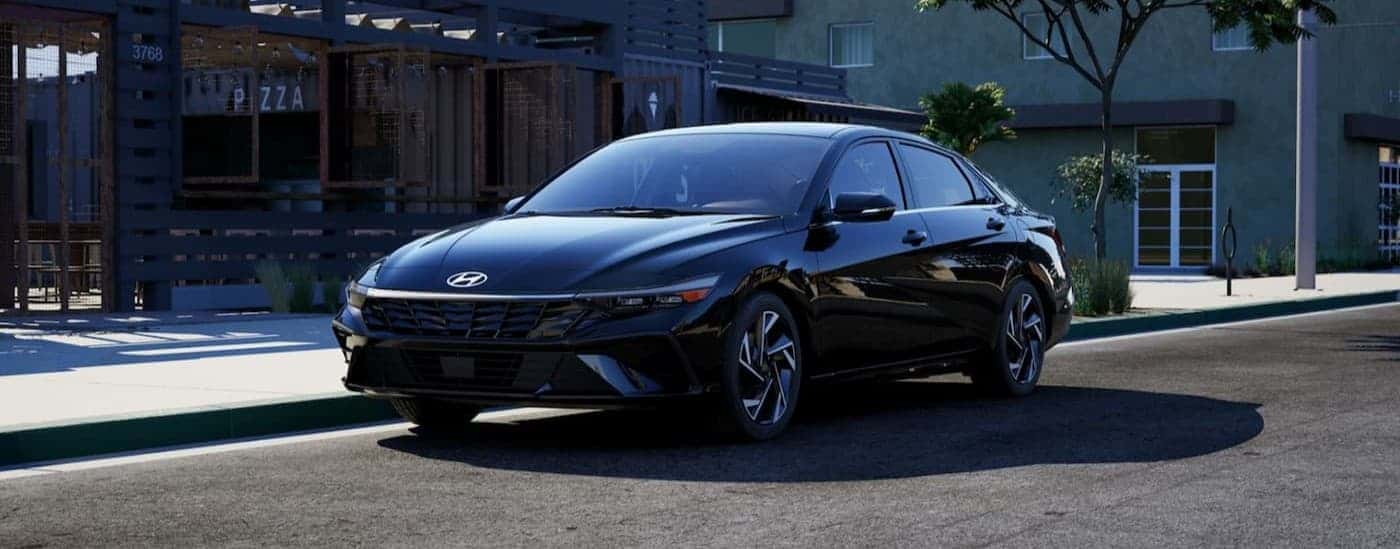 A black 2026 Hyundai Elantra parked in a city.