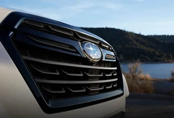 Close-up of Subaru logo on front of vehicle