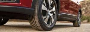 Ascent- closeup view-front tire-parked-red