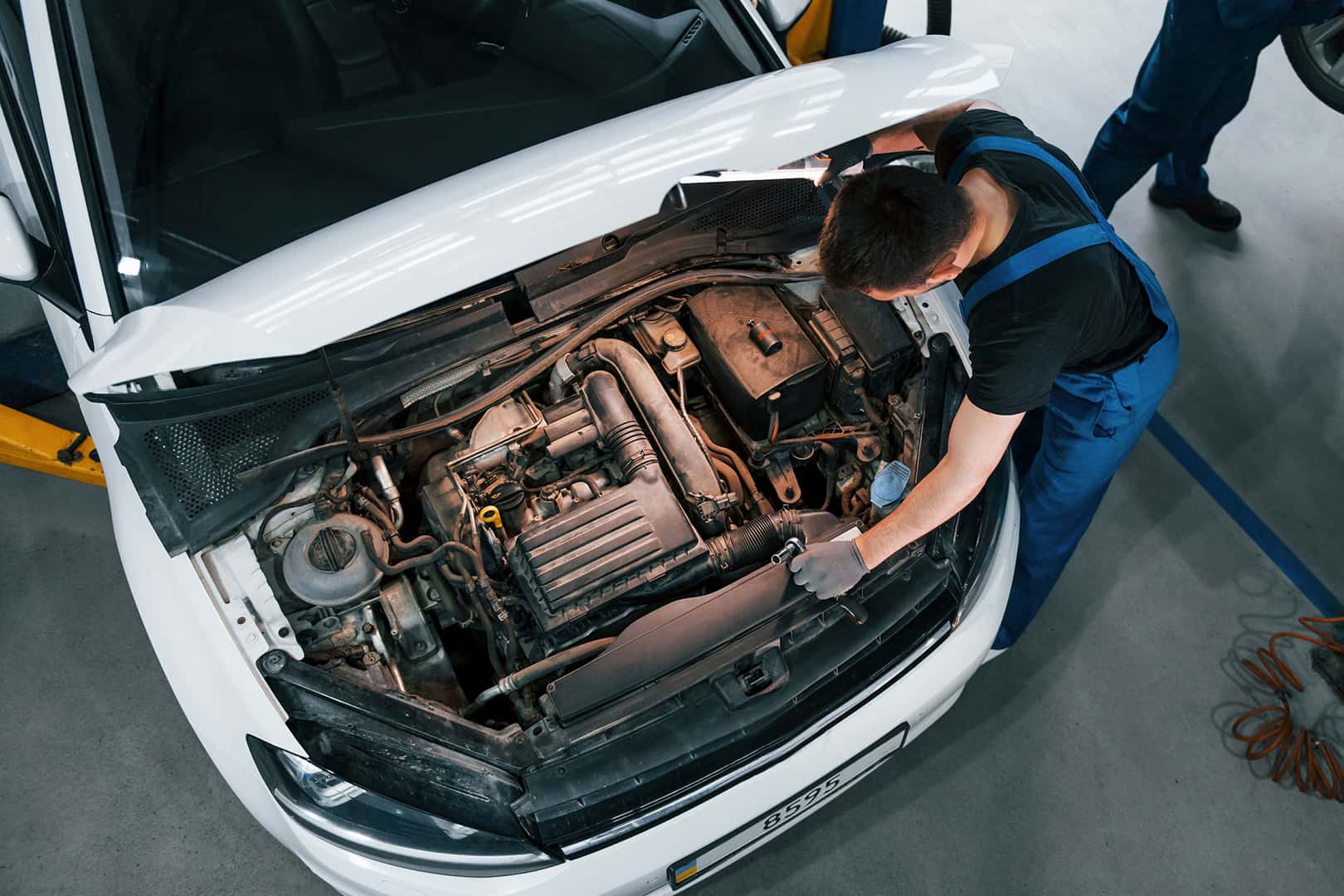 Technician performing engine service