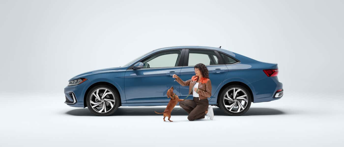 26 VW Jetta Exterior Side View With Woman And Dog